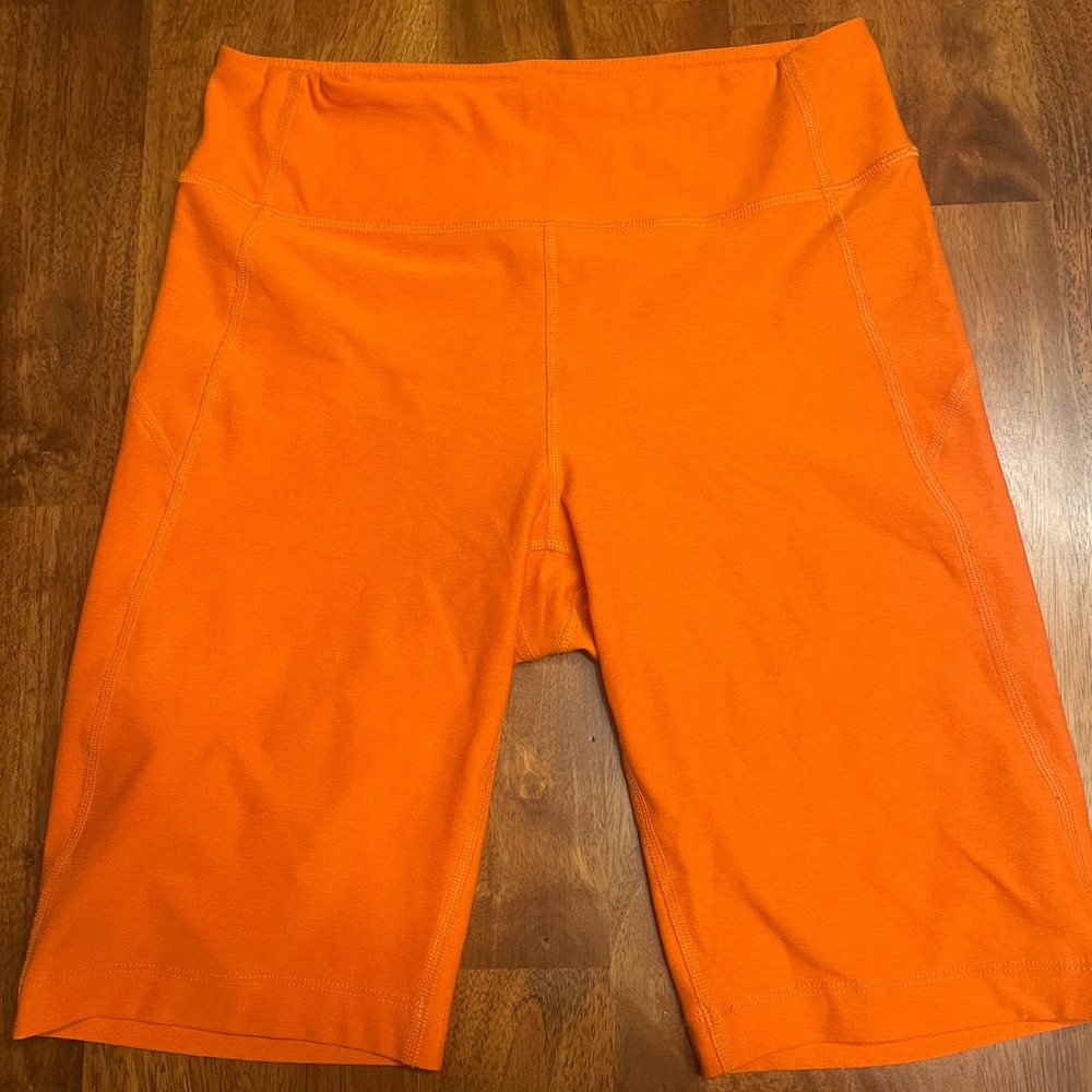 Orange Outdoor Voices bike shorts